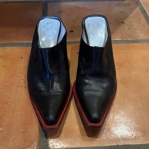 Cowboy boot style mule. Black with red detail.